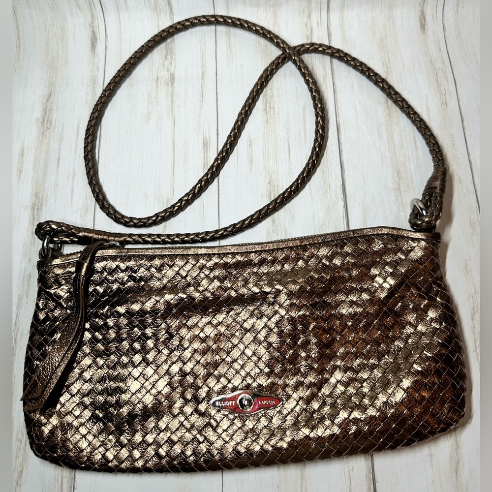 Elliott lucca leather metallic copper color,approx 12x6,woven corded handle.